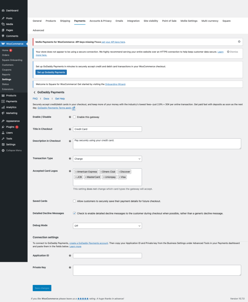 GoDaddy Payments for WooCommerce settings page in local WordPress sandbox showing Application ID Private Key and staging fields