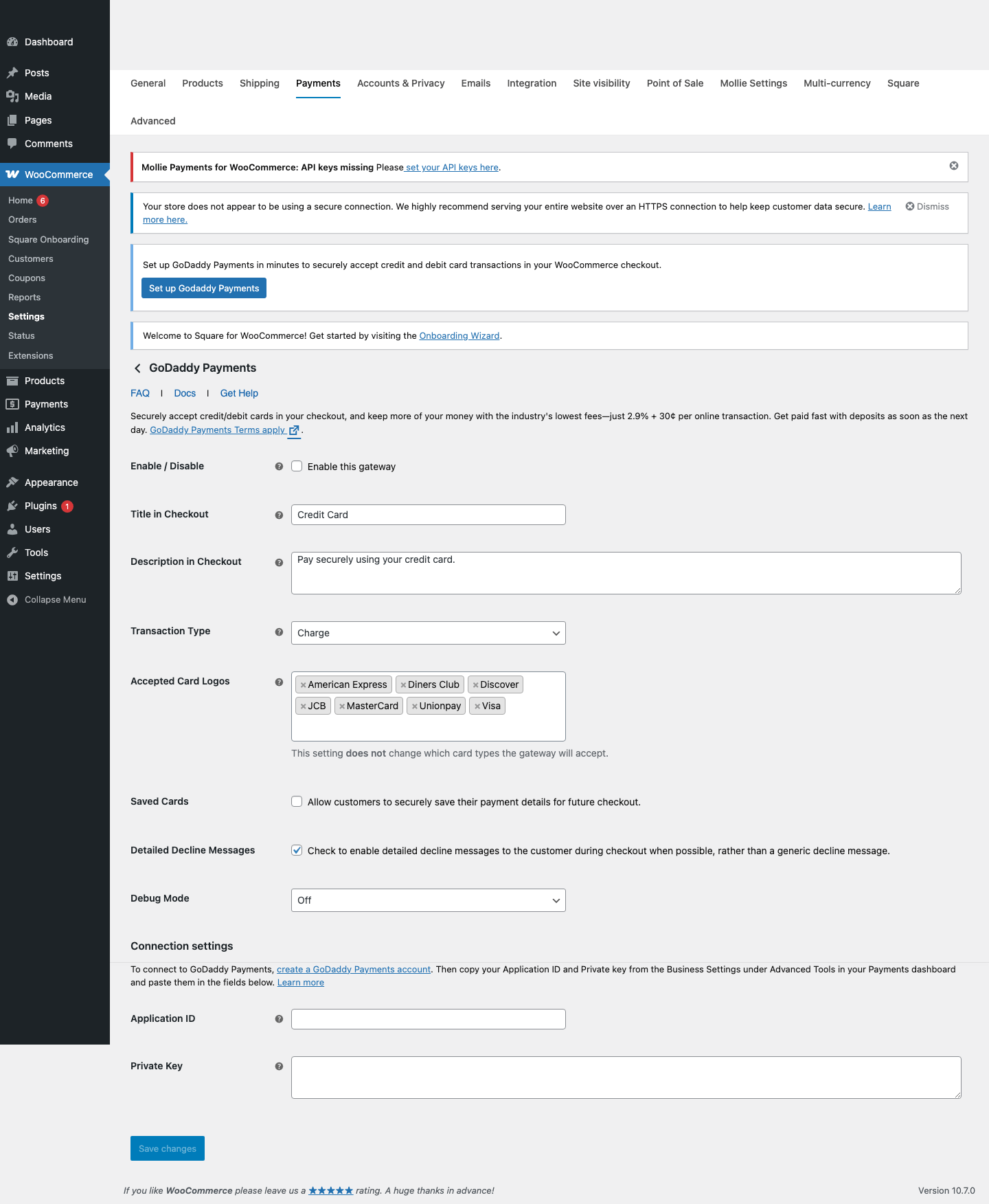 GoDaddy Payments for WooCommerce settings page in local WordPress sandbox showing Application ID Private Key and staging fields